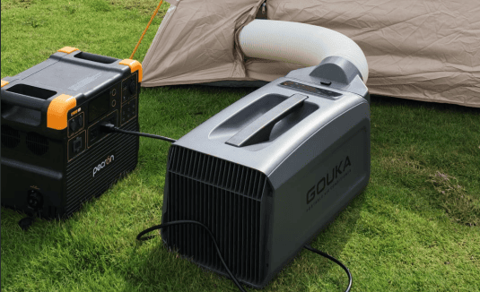 A comfortable camper van setup using a portable ac for camping to stay cool off-grid during summer.
